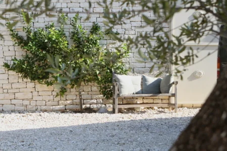 Alpha Homes Corfu Real Estate Kassiopi Stone Villa bench in the front door