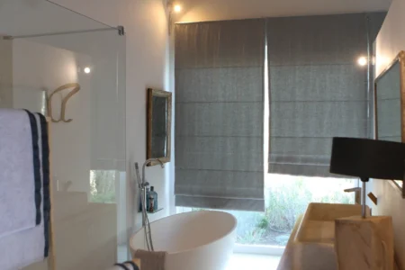 Alpha Homes Corfu Real Estate a bathroom with a tub sink and a mirror